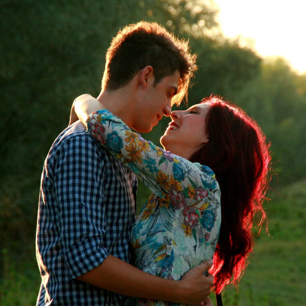 boy and girl hugging smiling and kissing