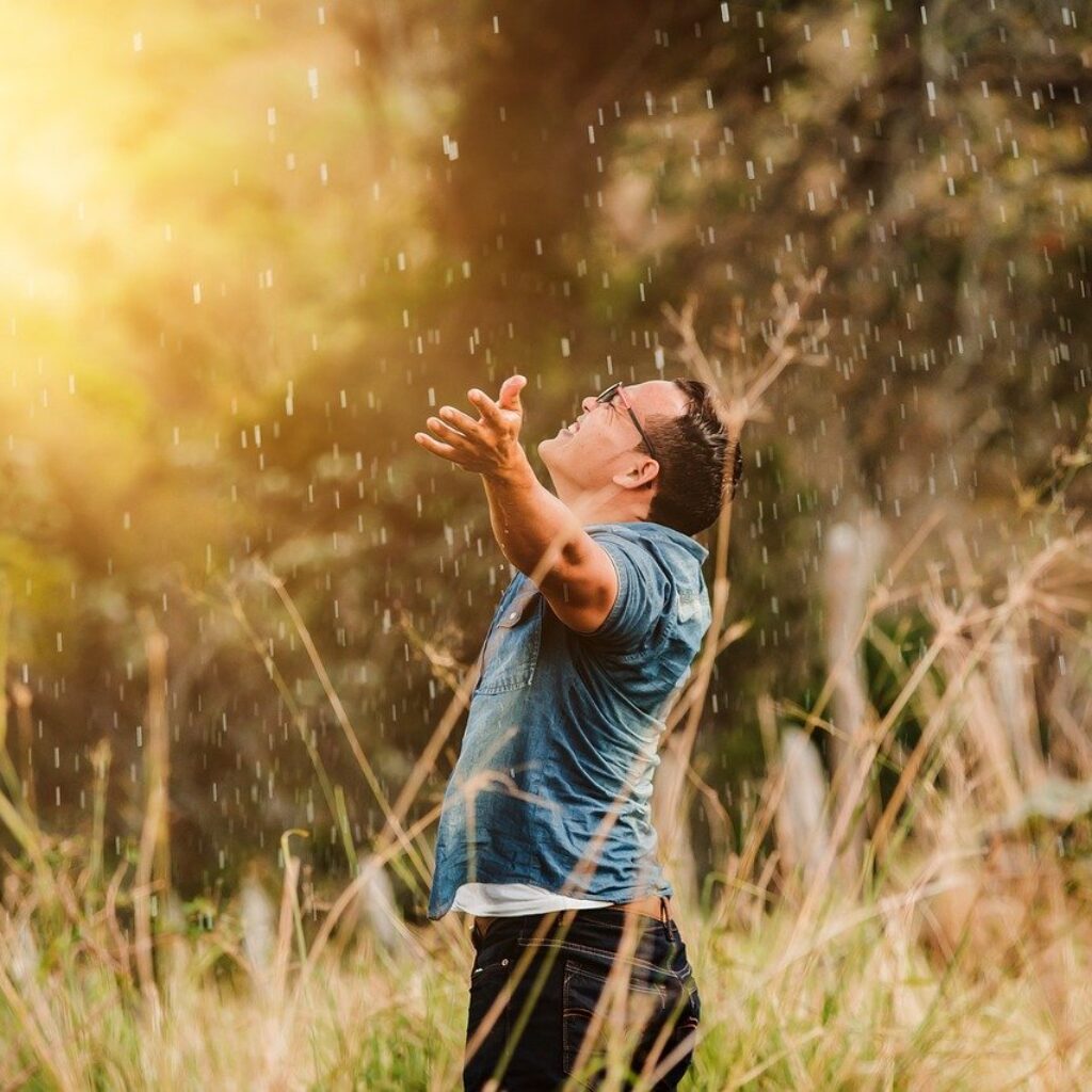 Man on knees worshipping, trusting, giving God thanks