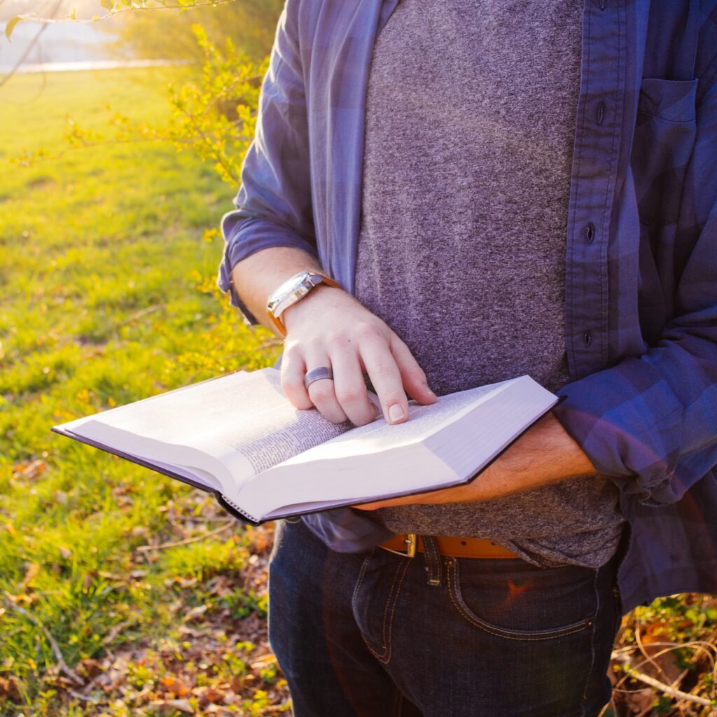 Man reading from the Bible word of God