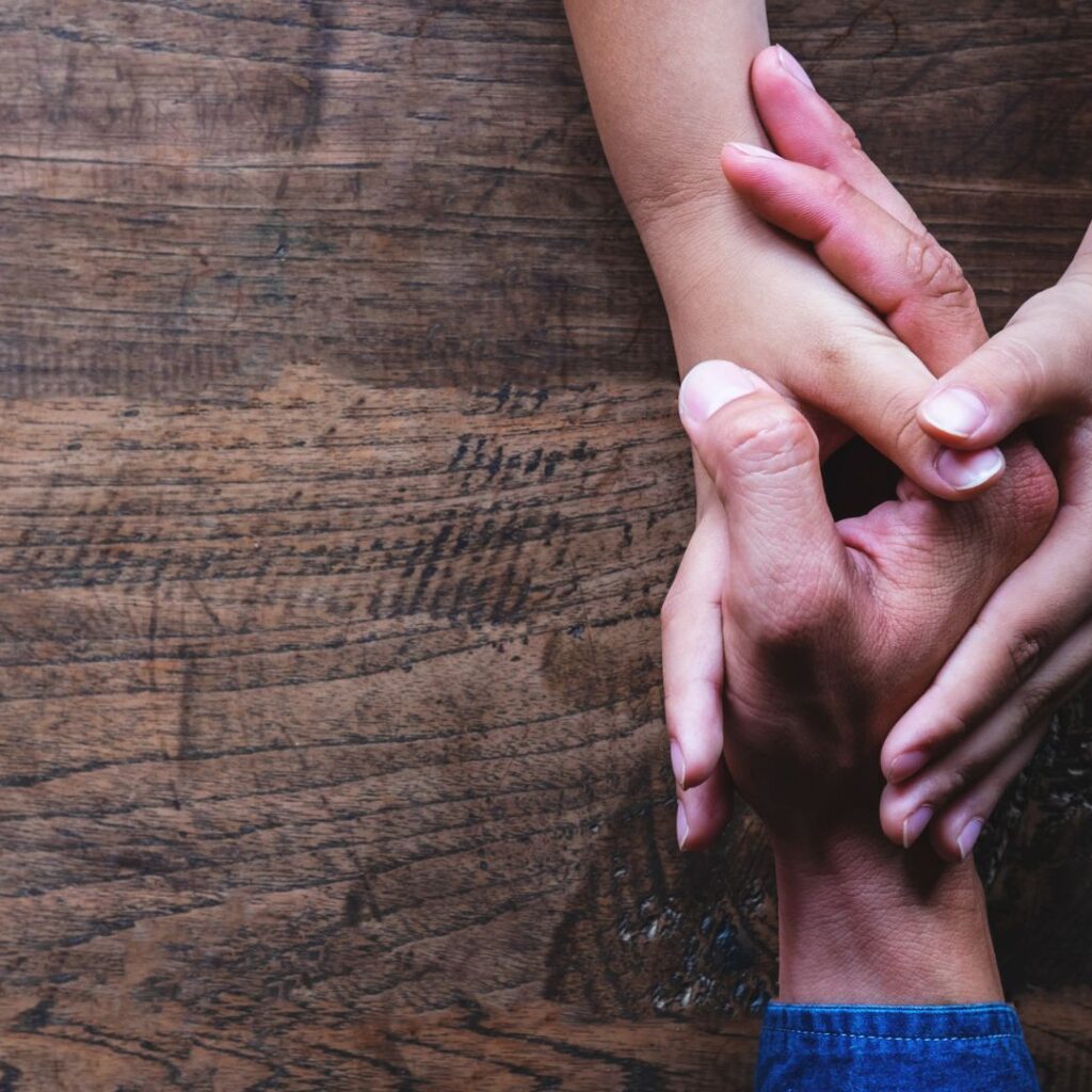 Parent Holding Hand With Child