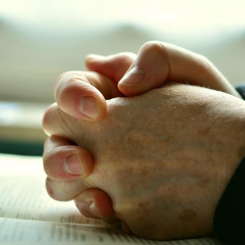 Hands crossed praying