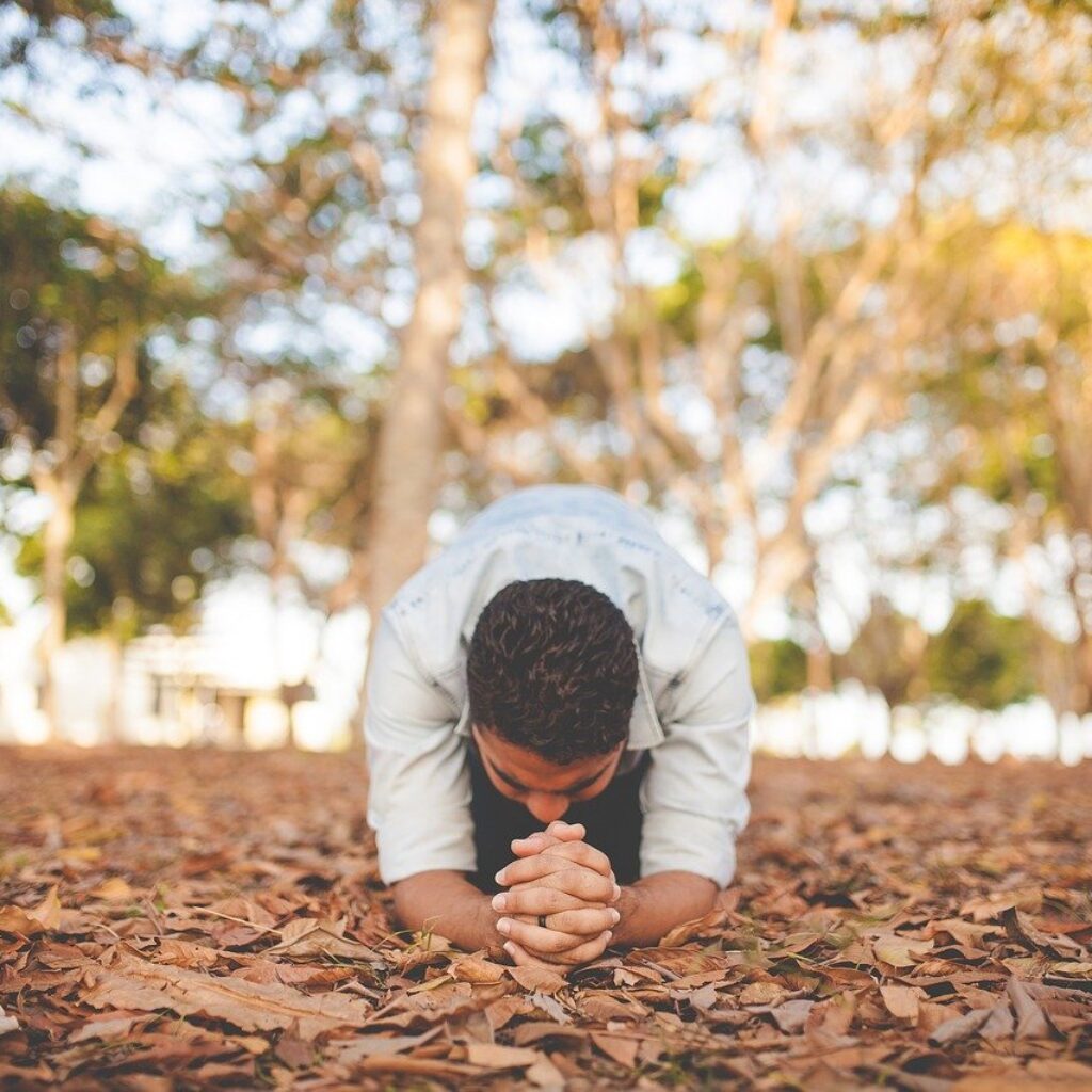 Man praying outside