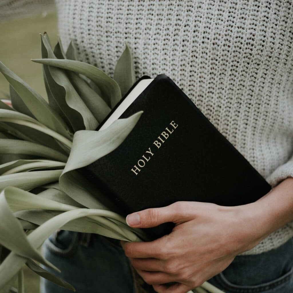 Girl holding Bible in hand-christianity facts