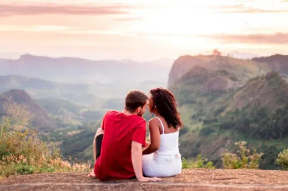 Two Christian dating and sitting overlooking a valley