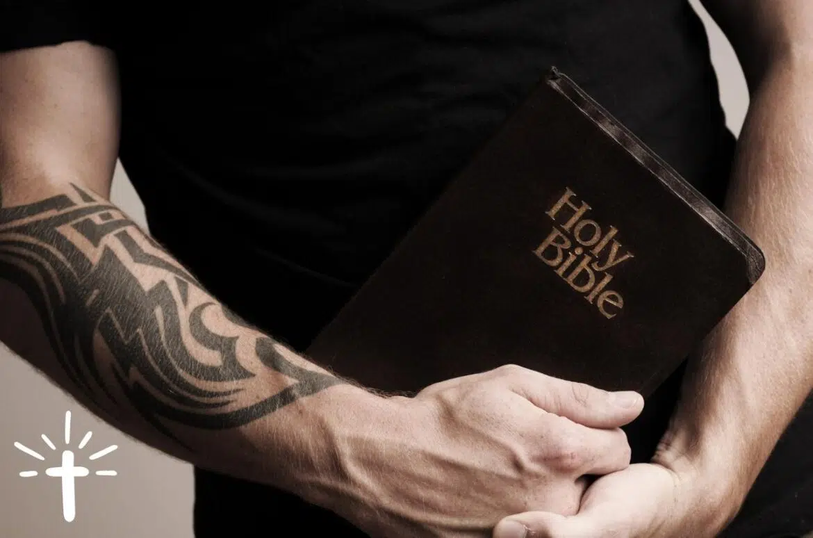Tattooed Man Holding Bible
