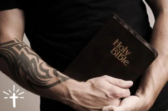Tattooed Man Holding Bible