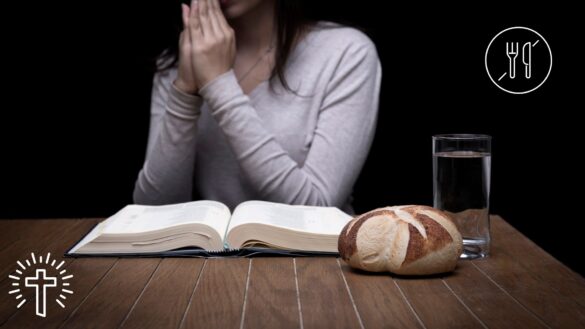 Woman Fasting and Praying With Bible Open